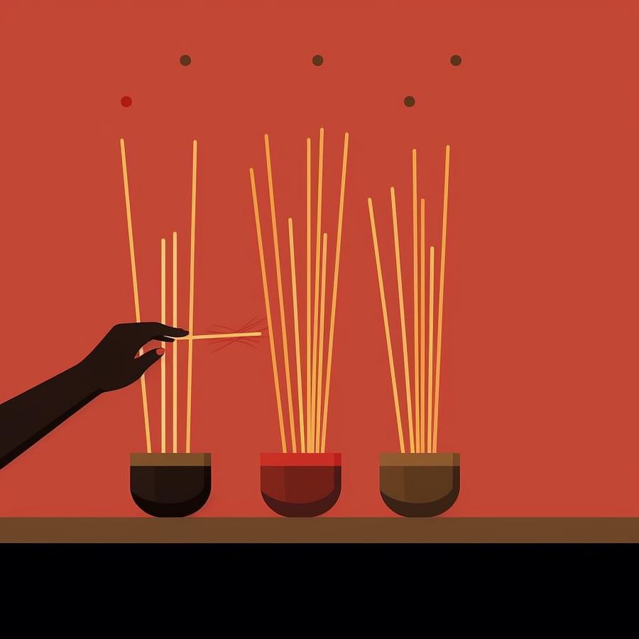 A hand selecting a stick of incense from a variety